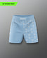 Light blue shorts with a pattern on a gray background