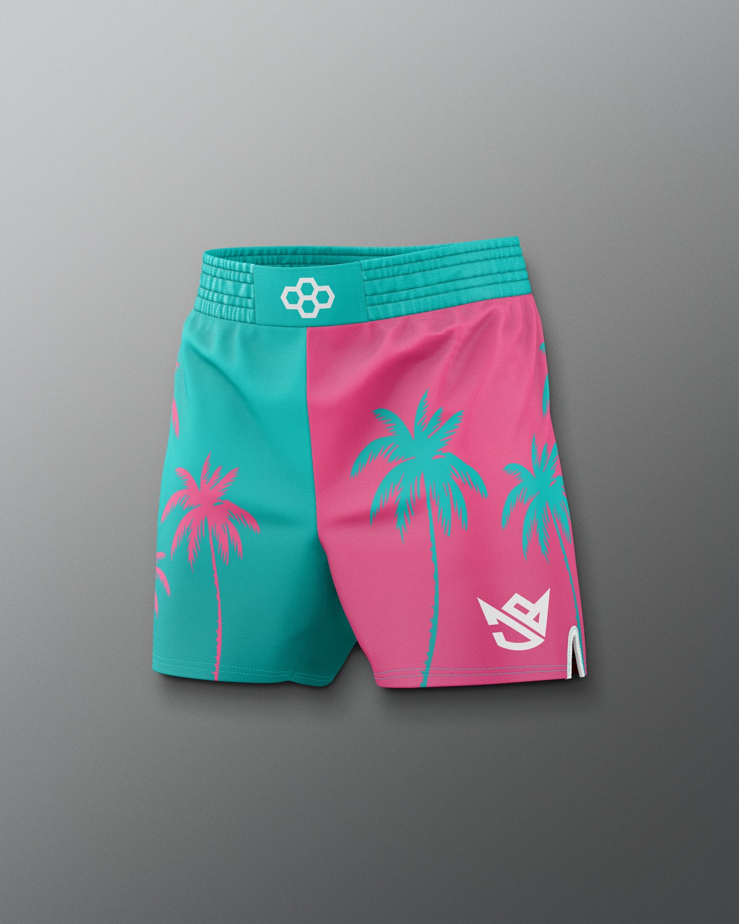 Two-tone pink and teal shorts with palm tree designs on a gray background