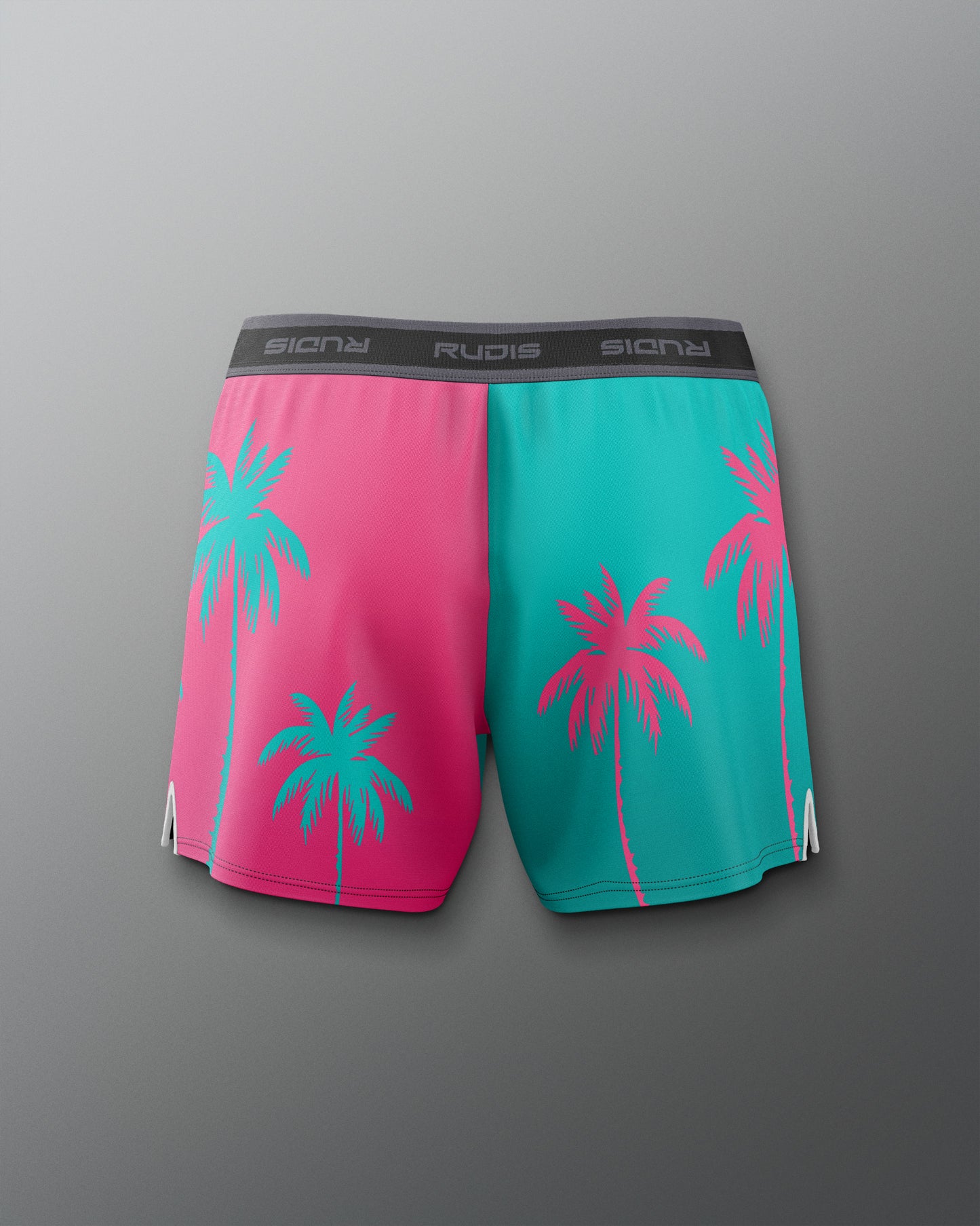 Color-blocked shorts with palm tree design on a gray background
