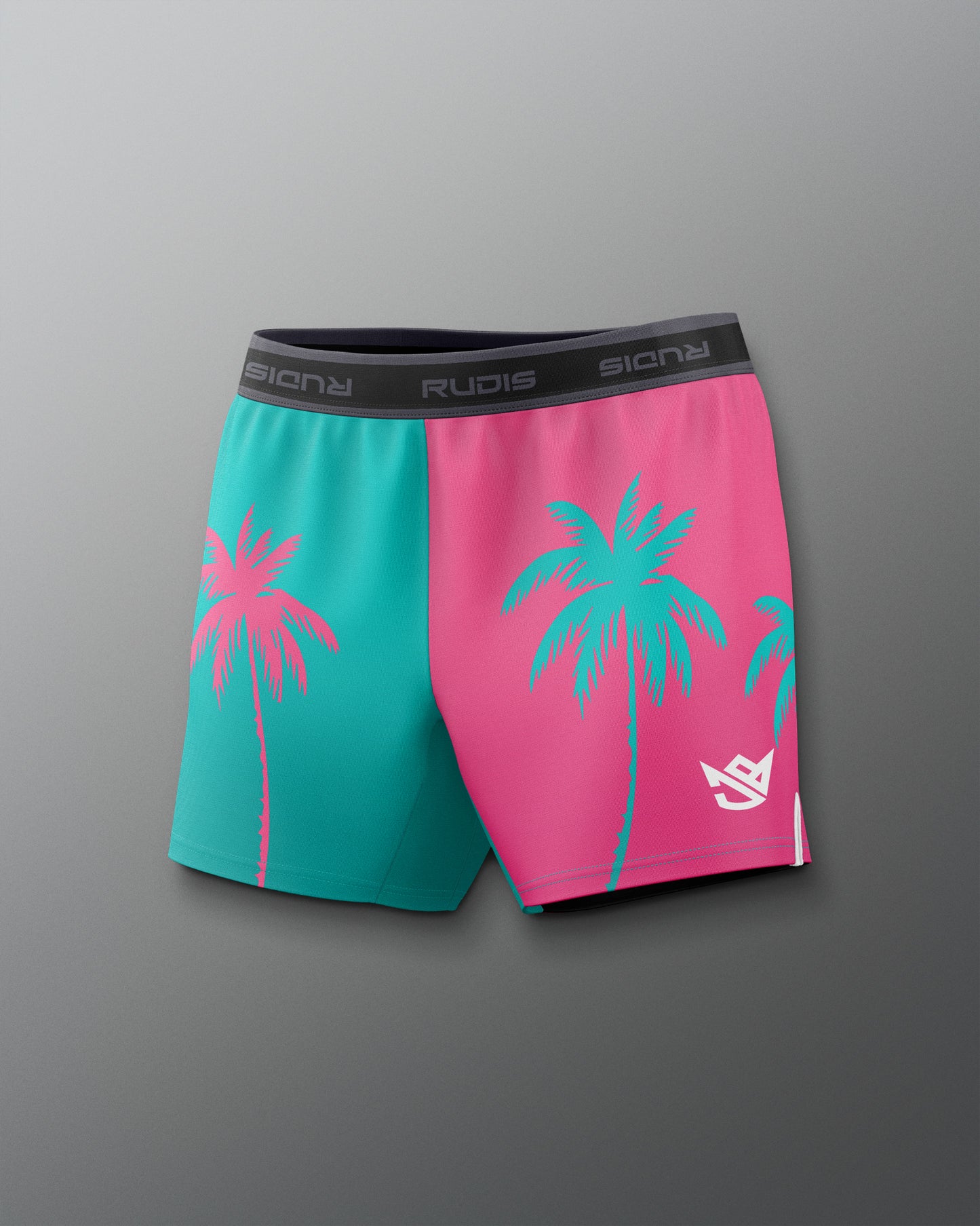 Color-blocked shorts with palm tree design on a gray background
