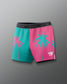Color-blocked shorts with palm tree design on a gray background