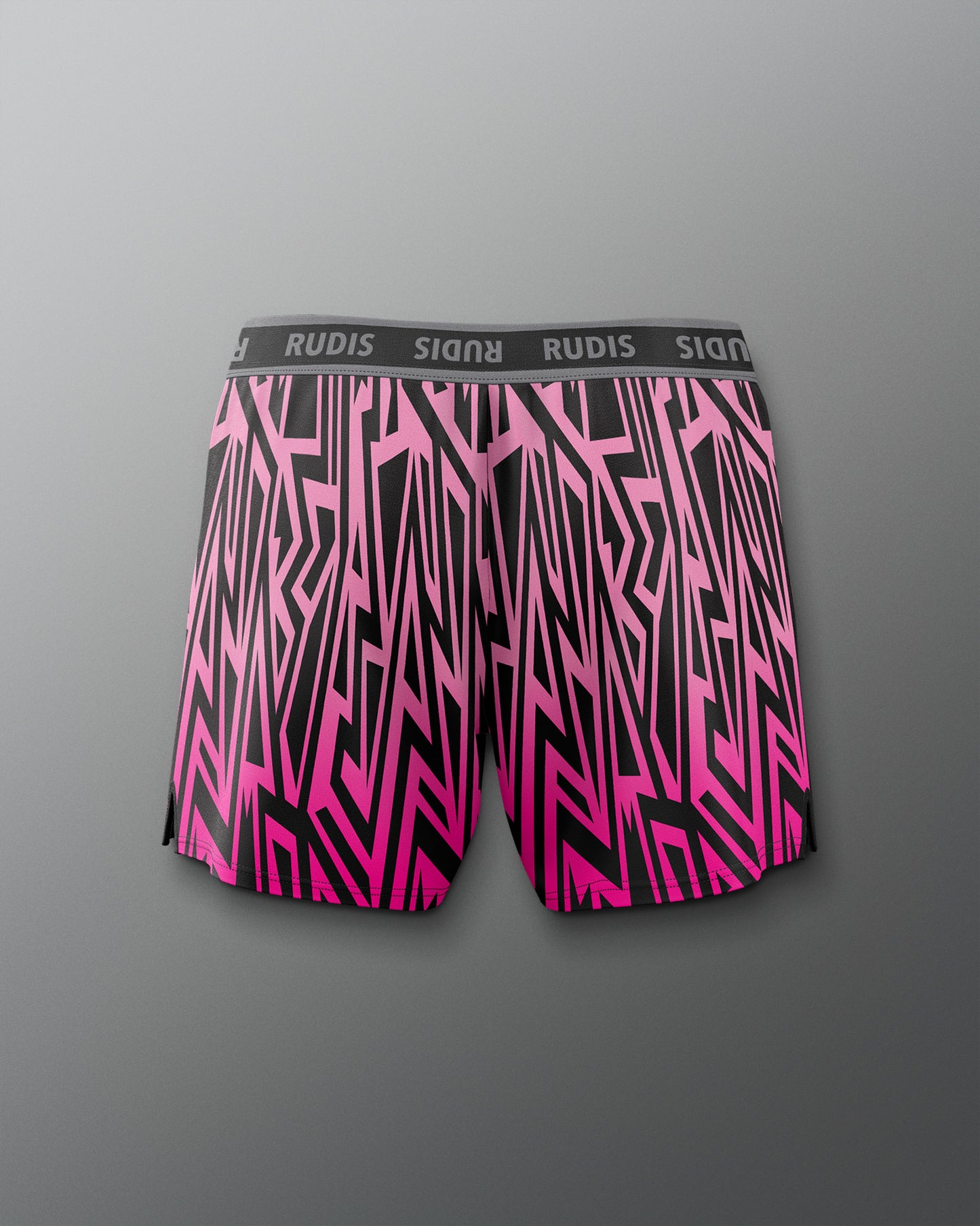 Pink and black patterned shorts with 'RUDIS' branding on a gray background