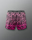 Pink and black patterned shorts with 'RUDIS' branding on a gray background
