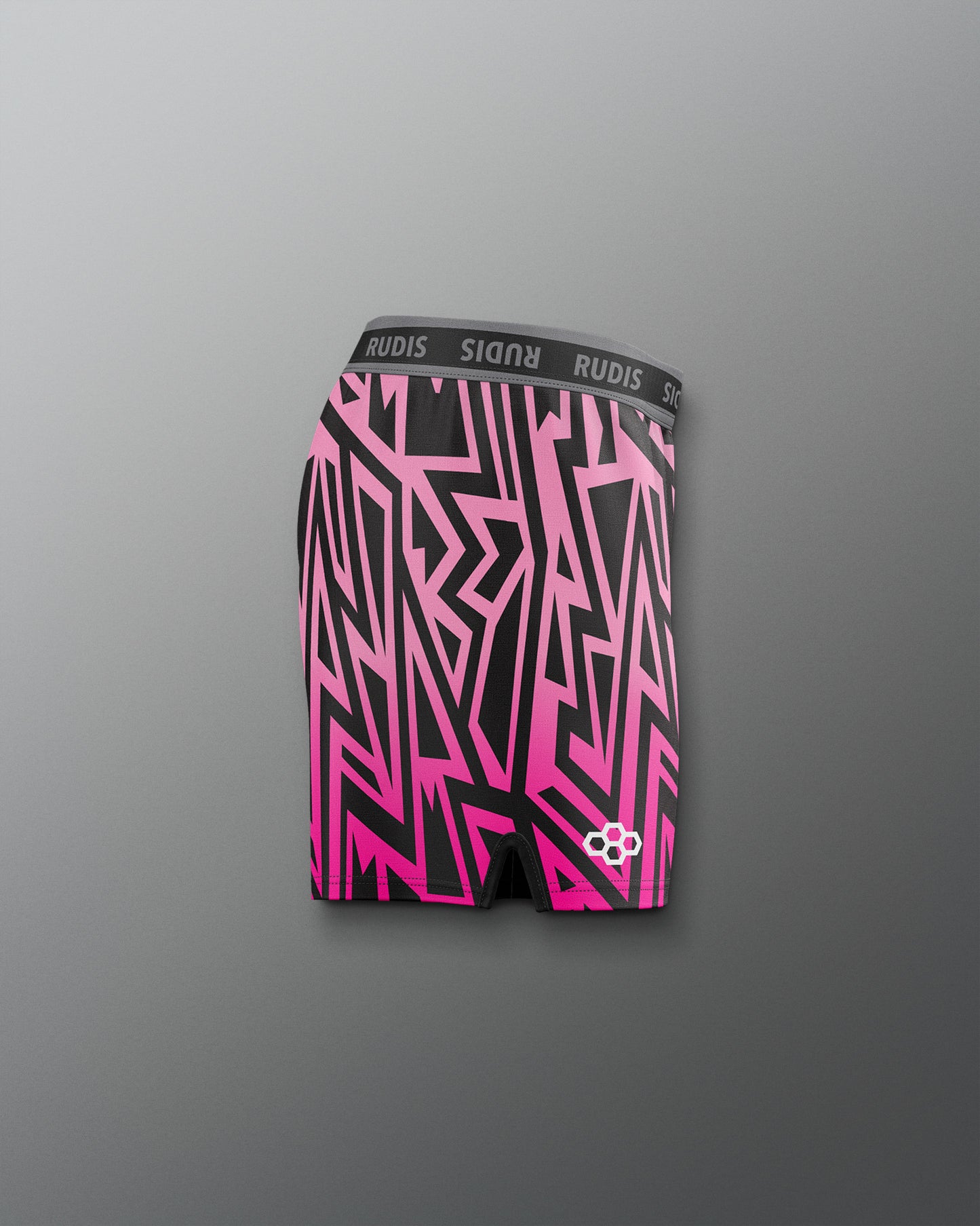 Pink and black patterned boxer briefs with 'RUDIS' branding on a gray background