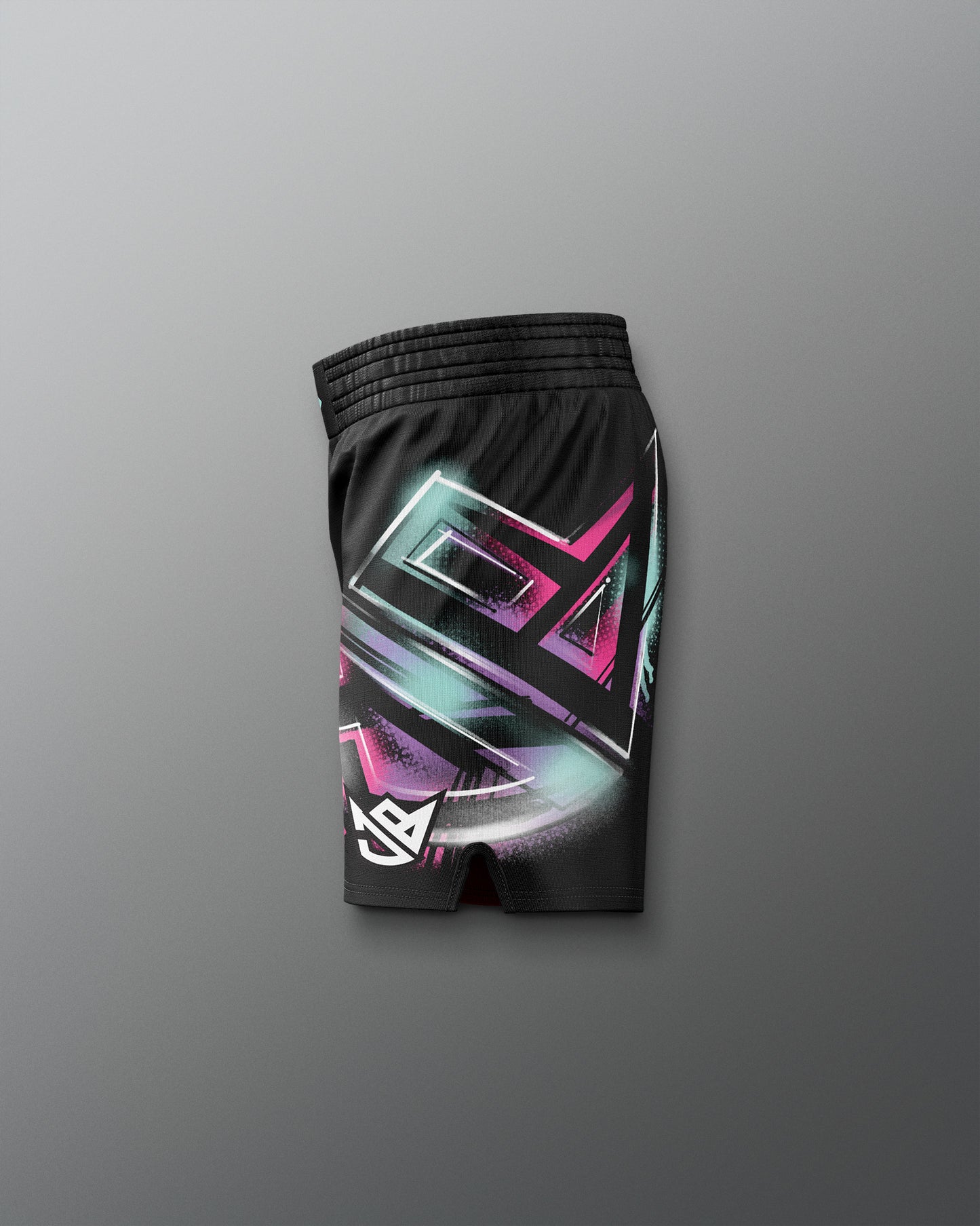 Black shorts with colorful geometric design on a gray background