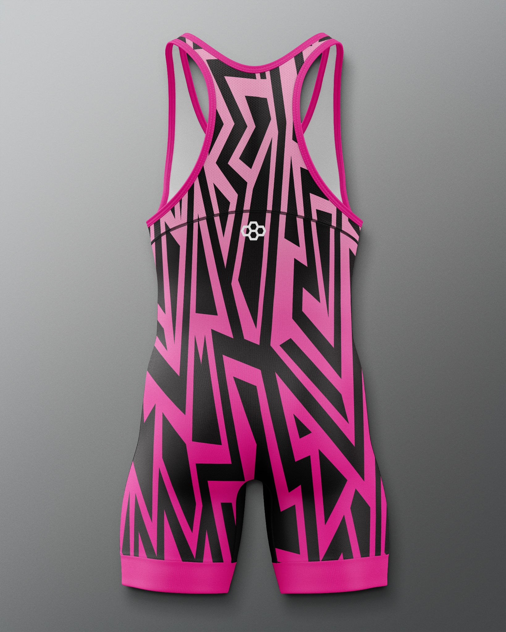Pink and black patterned swimsuit on a gray background