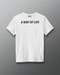 White t-shirt with text 'A Way of Life' on a gray background