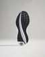 The image displays the outsole of a modern athletic shoe highlighting its intricate tread pattern and construction materials designed for optimal grip and durability