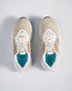 A pair of beige and white athletic shoes with a breathable mesh upper and colorful detailing accompanied by a snug fit for comfort during physical activities