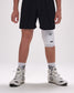 Person wearing a white knee pad on a plain background