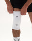 Close-up of RUDIS Omni-Impact White Wrestling Knee Pad with RUDIS and logo details