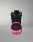A high-top black wrestling shoe shown from the rear, featuring a black textured upper, a vibrant hot pink curved accent line, and a translucent pink and orange sole with the brand name 'RUDIS' embossed on the heel.