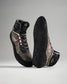 This image features a pair of stylish high-top athletic shoes with a modern design showcasing a unique patterned upper and a textured black sole