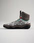 A stylish high-top sneaker featuring a unique gray camouflage pattern vibrant teal and red accents and a robust sole designed for performance