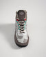 A stylish gray and white camouflage boot with colorful accents and sturdy construction highlighting a blend of modern design and functional features