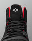 Black wrestling shoe with red accents on a gray background