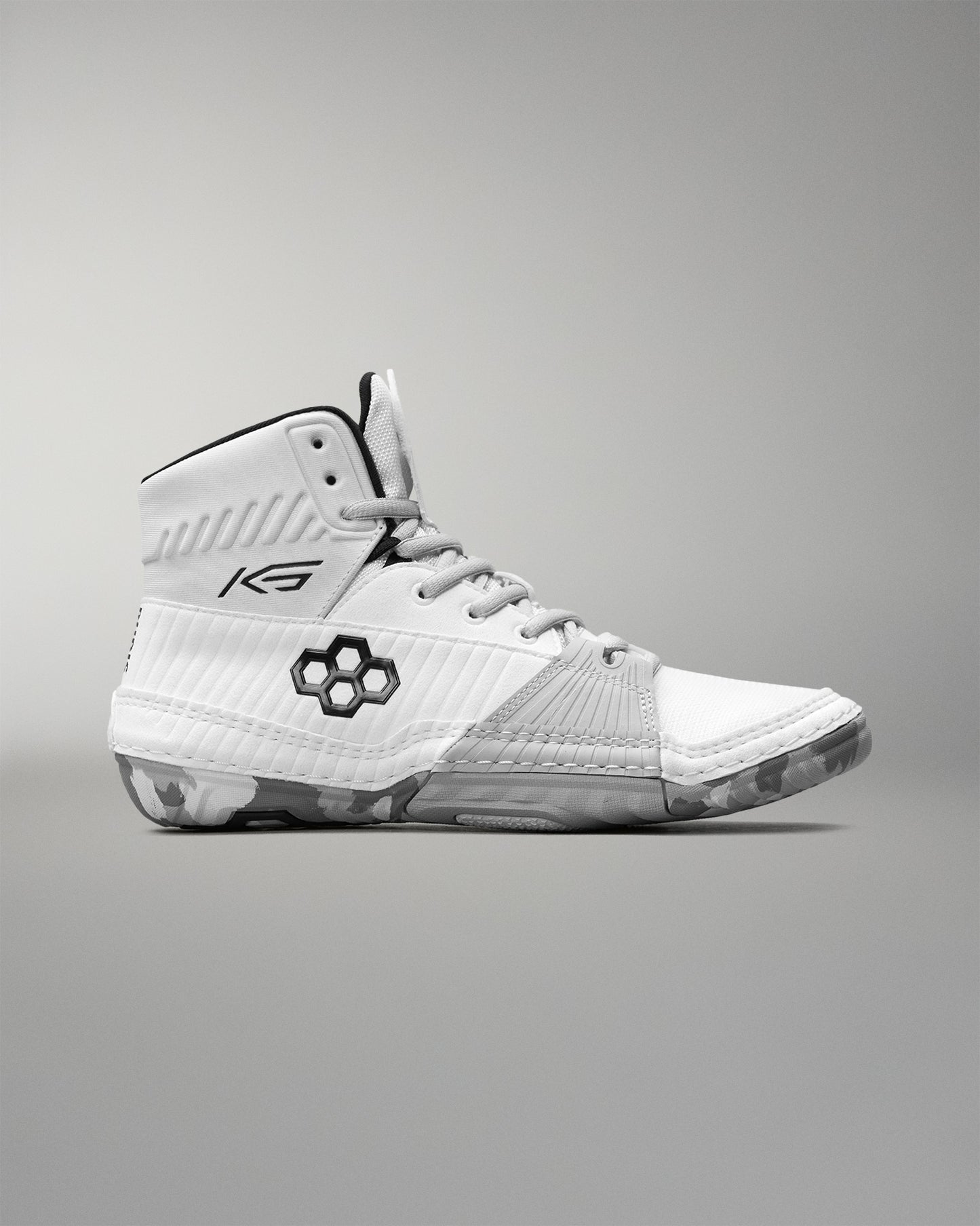 White wrestling shoe with black accents on a gray background