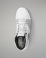 White wrestling shoe with black sole on a gray background