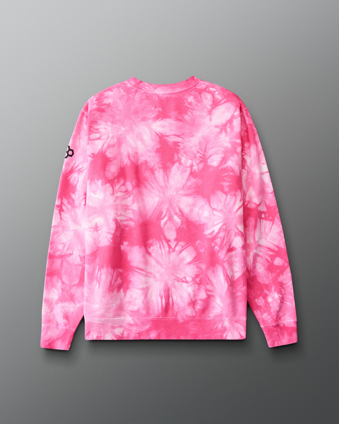 Pink and white tie-dye sweatshirt on a gray background