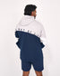 A man shown from the back wearing a color-blocked hoodie and matching shorts. The hoodie has a light gray upper section, white sleeves, and a navy blue lower section, with the text 'WAY OF LIFE' printed across the shoulders.