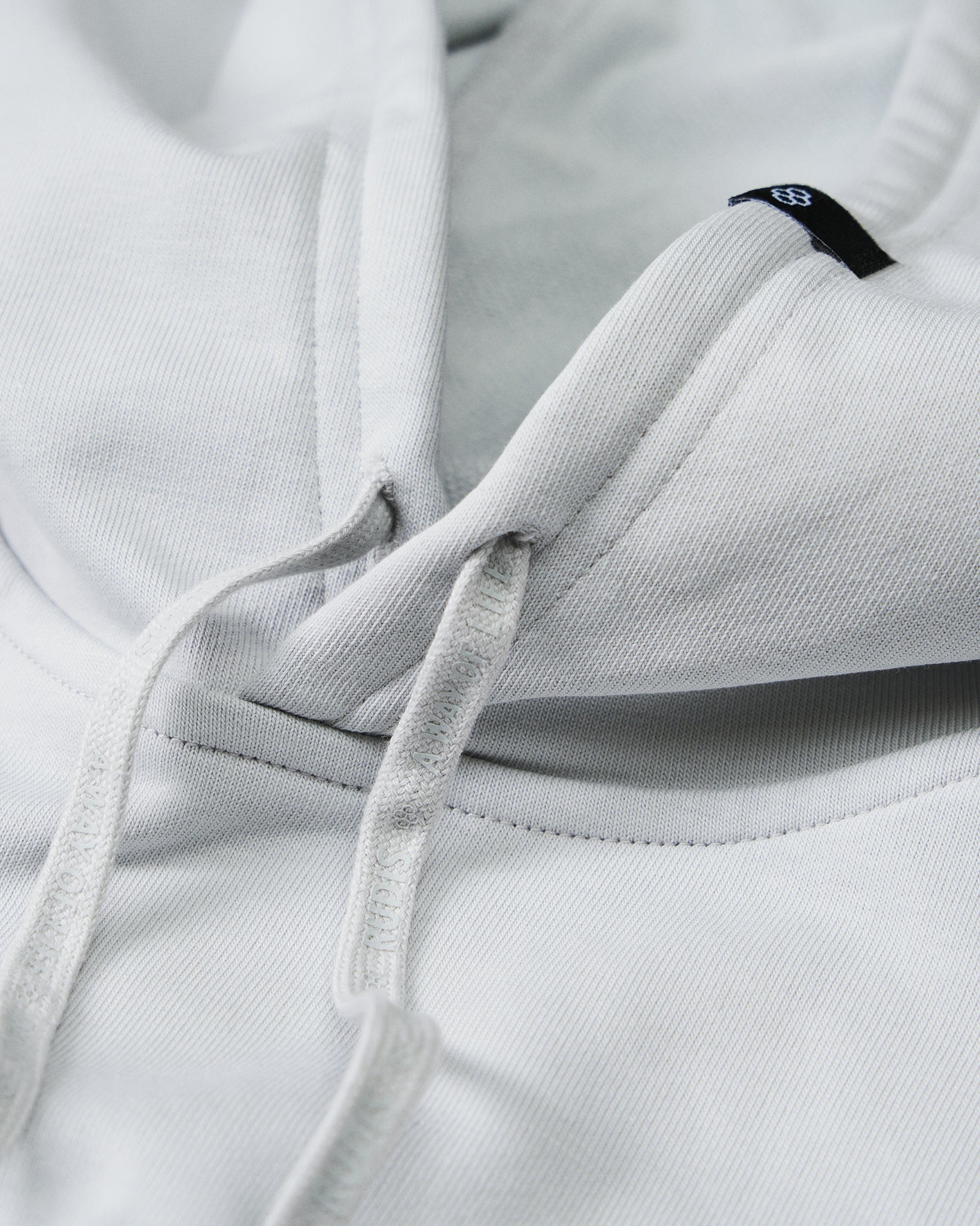 Close-up of the RUDIS Lacrosse Elite Terry Hoodie drawstrings and hood, showcasing premium French terry fabric, embossed drawcords, and refined construction details.