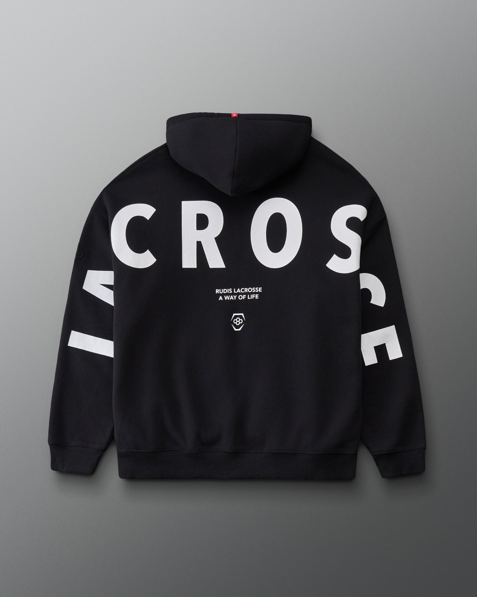 Back view of the RUDIS Lacrosse Relaxed Comfort Fleece Hoodie in Black, showcasing oversized white LACROSSE lettering across the back and sleeves with RUDIS Lacrosse A Way of Life branding.