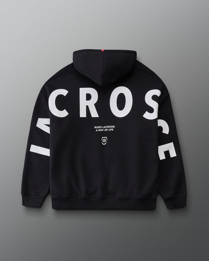 Back view of the RUDIS Lacrosse Relaxed Comfort Fleece Hoodie in Black, showcasing oversized white LACROSSE lettering across the back and sleeves with RUDIS Lacrosse A Way of Life branding.