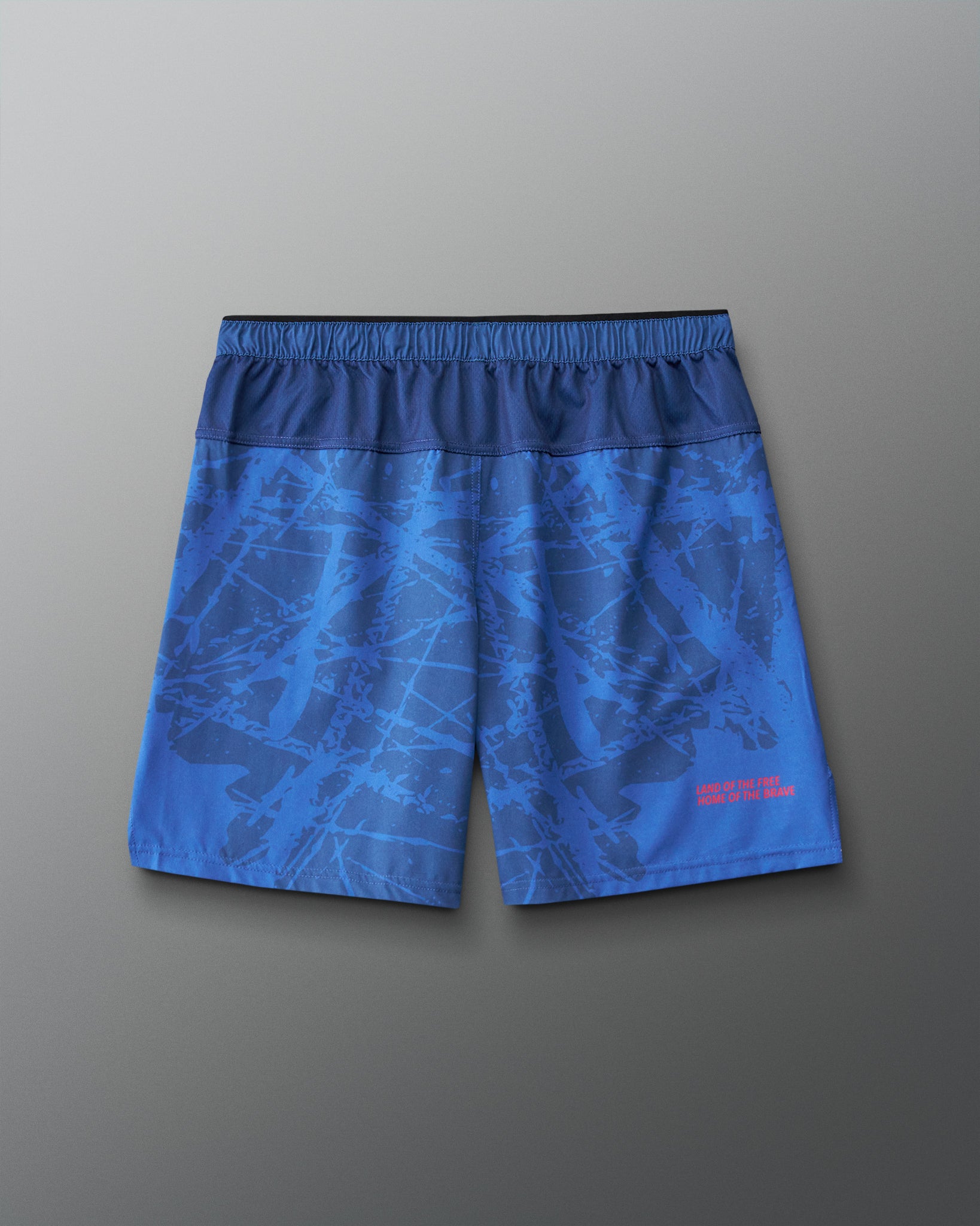 Back view of RUDIS Lacrosse Flag 7" Attack Shorts in navy with tonal graphic print and “Land of the Free, Home of the Brave” detail.