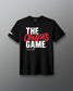 Black t-shirt with 'The Creator's Game' text on a gray background
