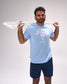 Male athlete wearing the RUDIS LAX Motto Elite Super Soft T-Shirt in Light Blue featuring bold "Lacrosse" graphic with lacrosse head artwork while holding a lacrosse stick.