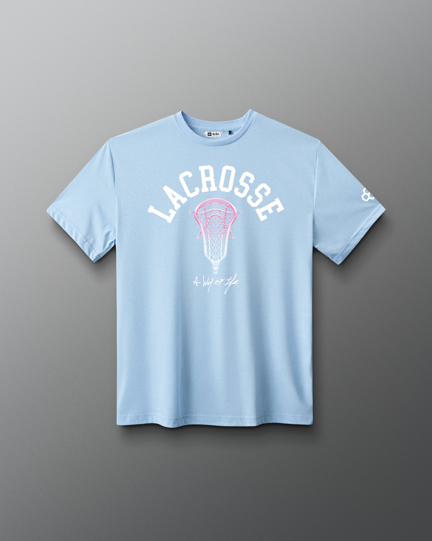 Light blue t-shirt with lacrosse graphic and text on a gray background