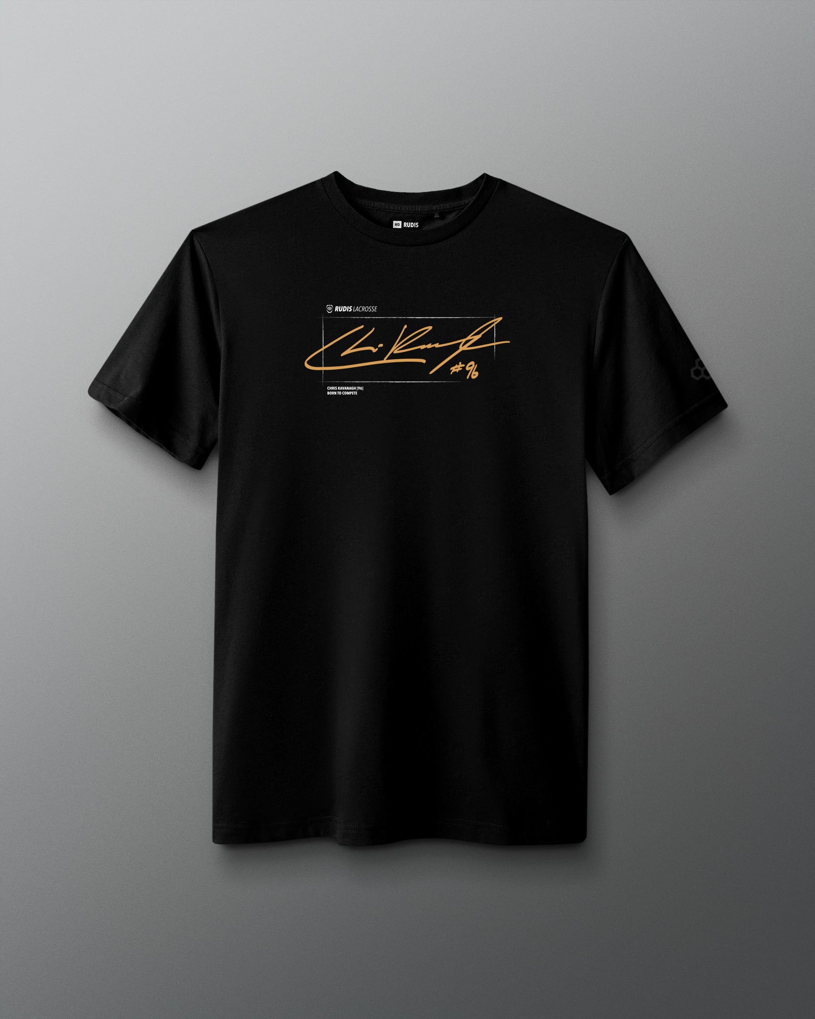 A black short-sleeve crewneck t-shirt featuring a gold signature-style graphic and small text on the chest, displayed against a dark gray gradient background.