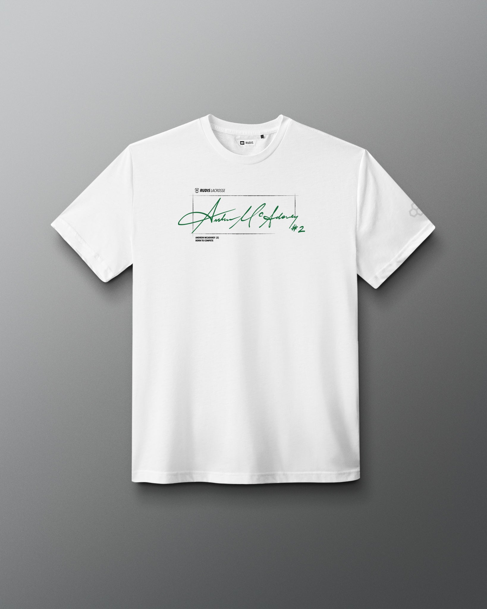 A white short-sleeve crewneck t-shirt featuring a green signature graphic and text on the chest, displayed against a dark gray gradient background.