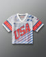 Front view of RUDIS Lacrosse Stars and Stripes Throwback Porthole Jersey in white mesh with red and blue USA graphics and American flag detail.