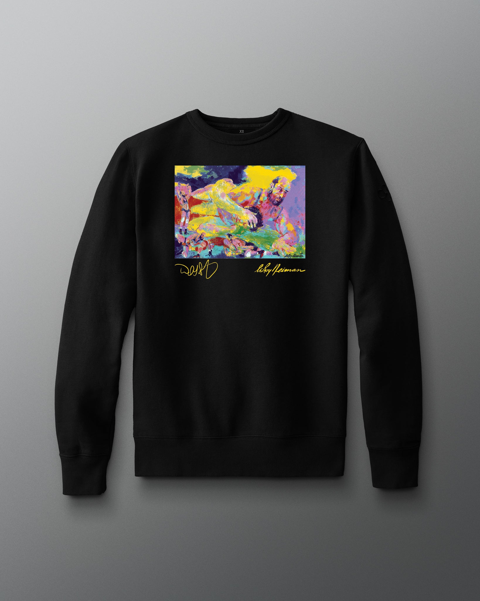 Black sweatshirt with a colorful graphic design on a gray background