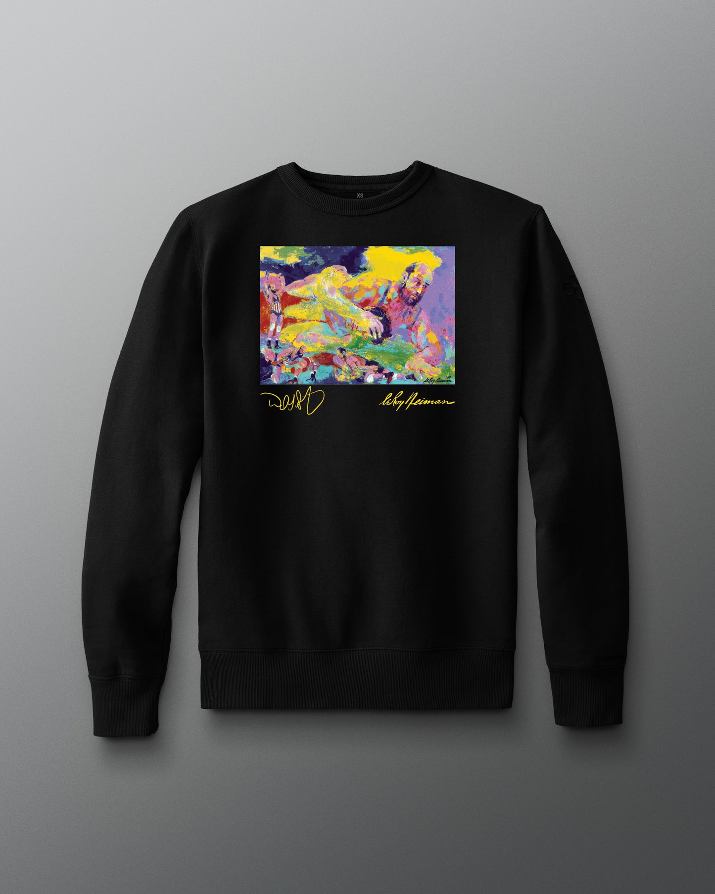 Black sweatshirt with a colorful graphic design on a gray background