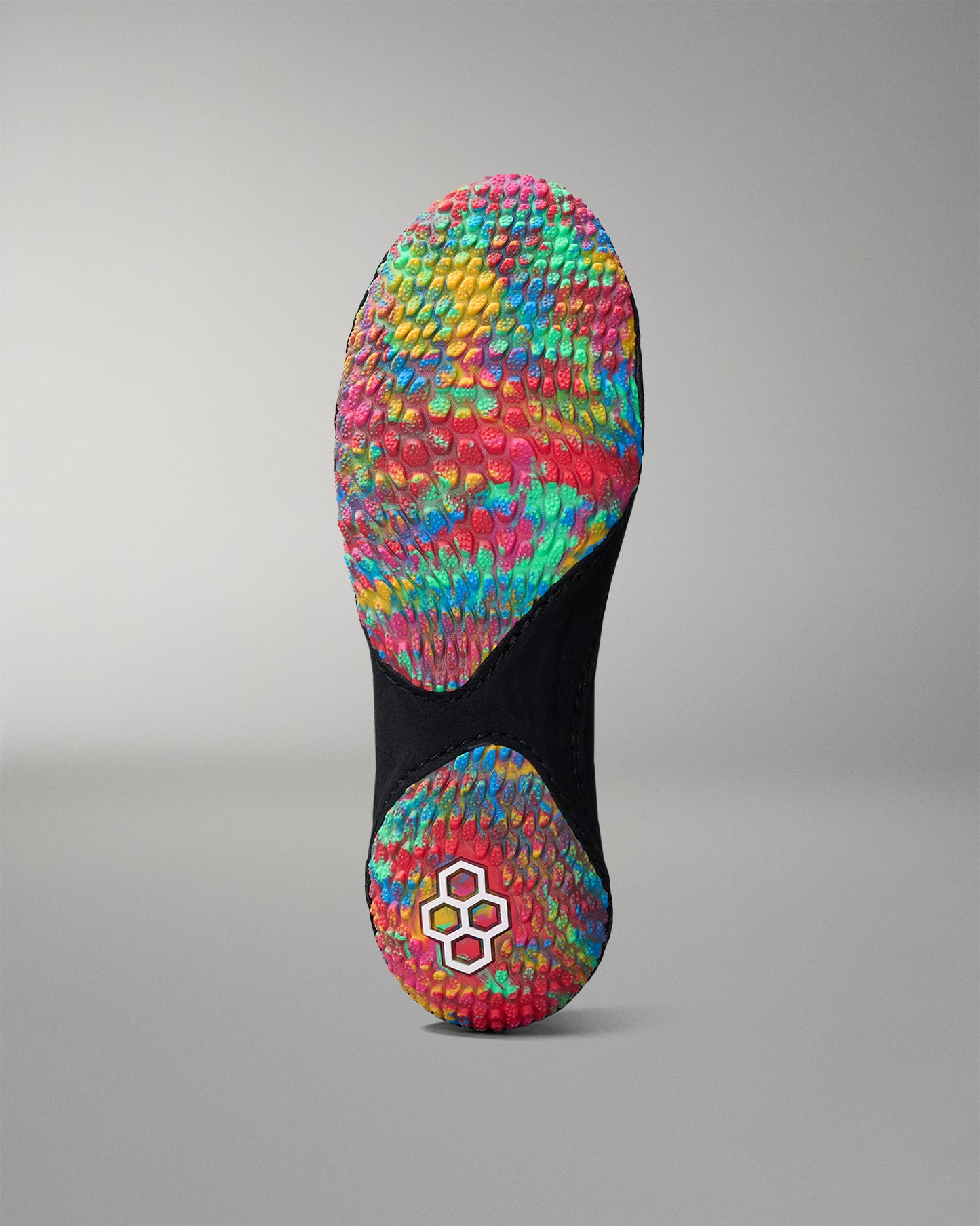 Colorful wrestling shoe sole with textured pattern on a gray background