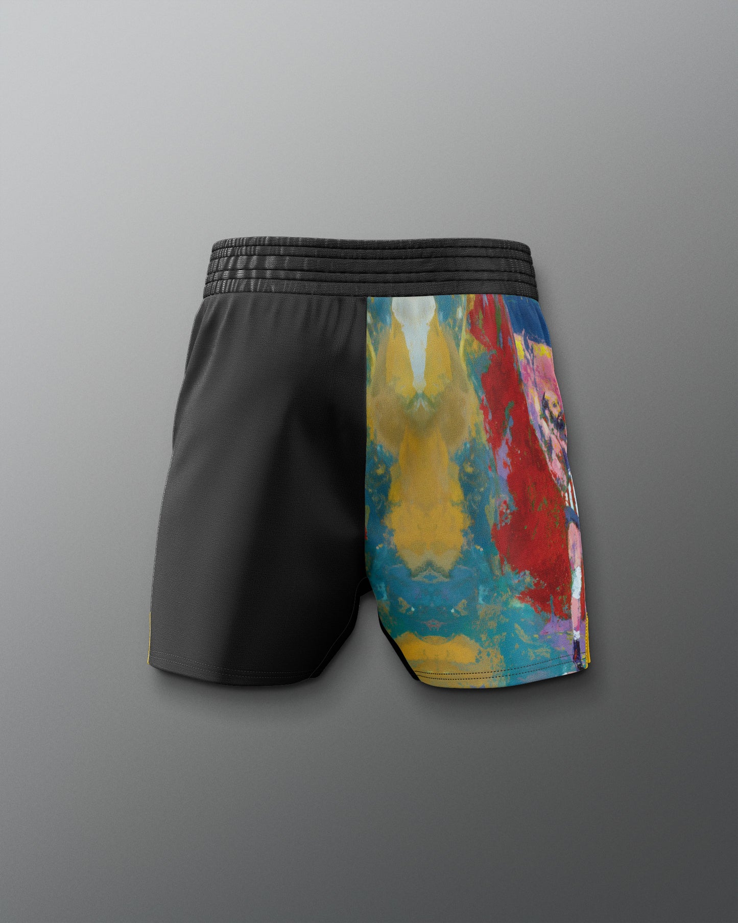 Black shorts with a colorful abstract pattern on a gray background
