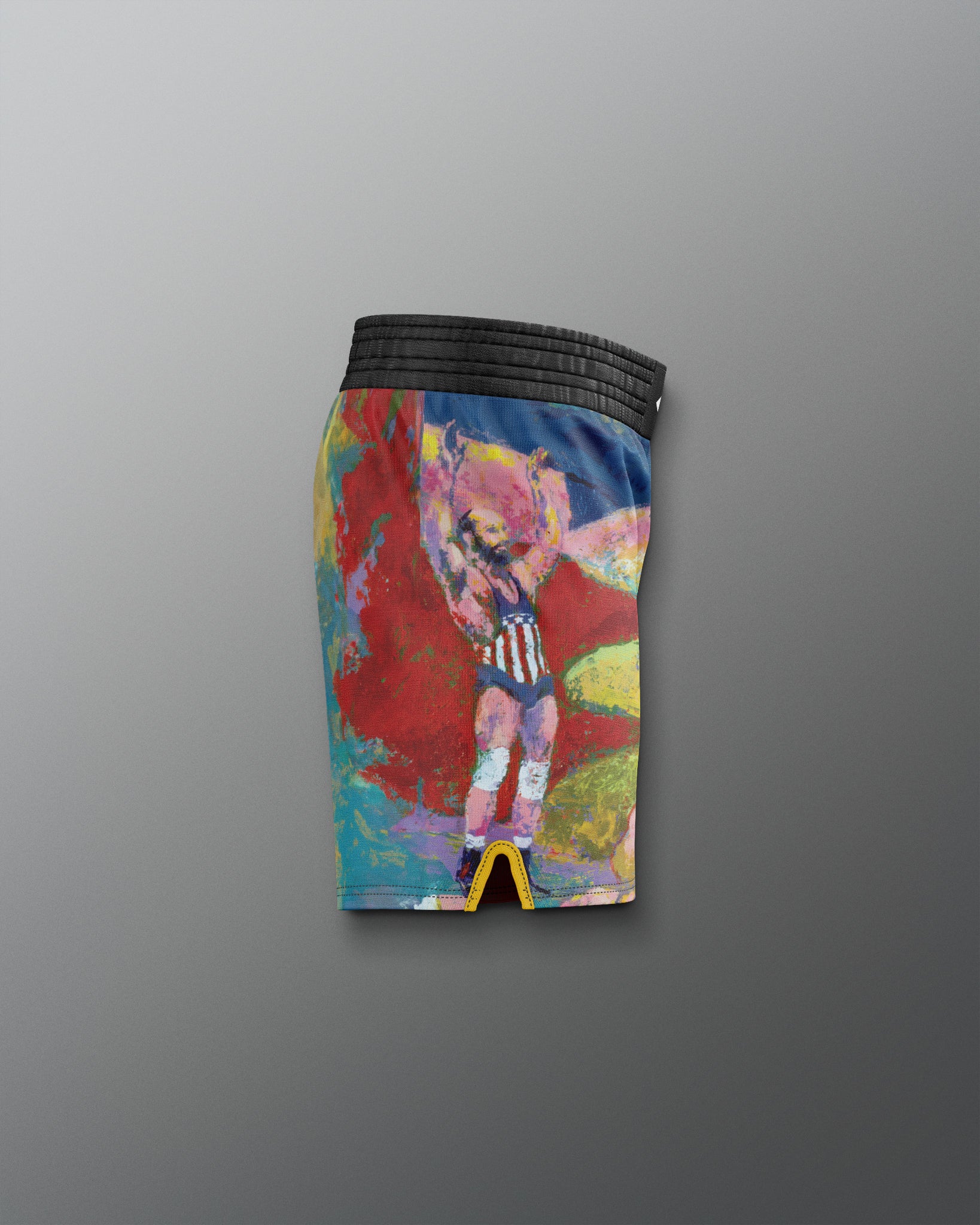 Colorful athletic shorts with a graphic design on a gray background