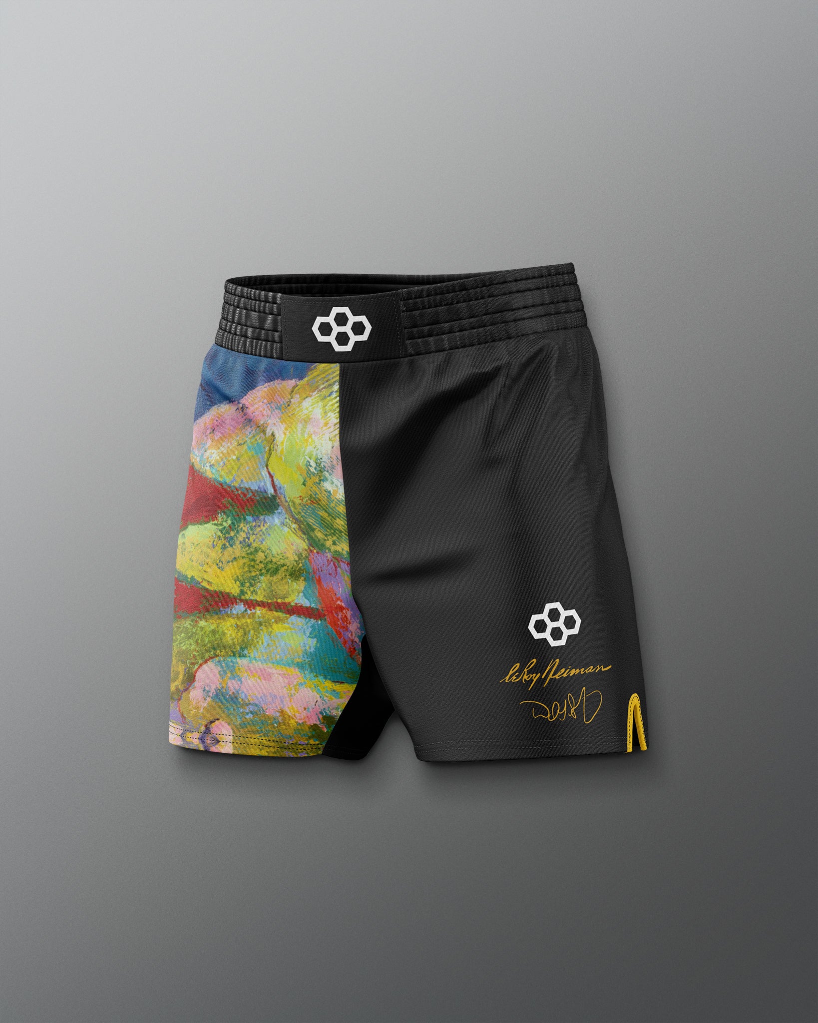 Black shorts with colorful design on the left side against a gray background