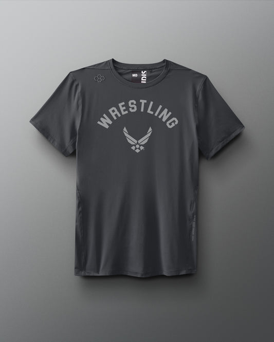 Front view of a dark gray RUDIS T-shirt featuring the word ‘WRESTLING’ arched above the U.S. Air Force logo in a tonal print across the chest.