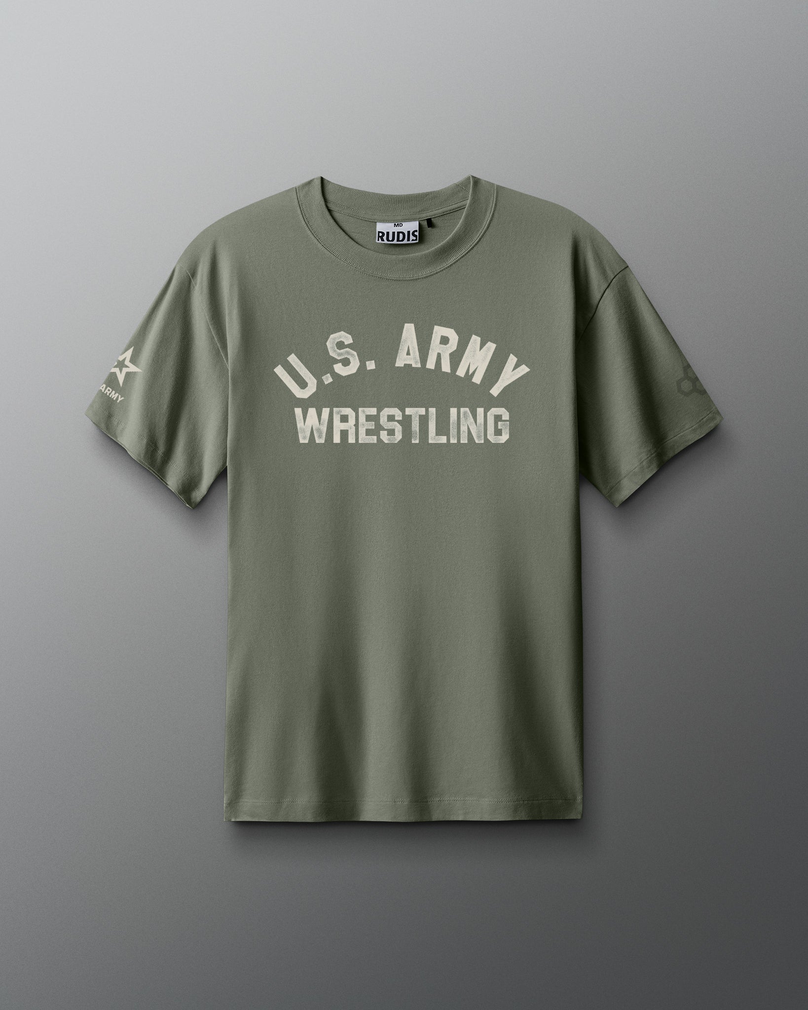 Front view of an olive green RUDIS T-shirt with distressed white text reading ‘U.S. ARMY WRESTLING’ across the chest. A U.S. Army logo appears on the left sleeve, and the RUDIS hexagon logo on the right sleeve.
