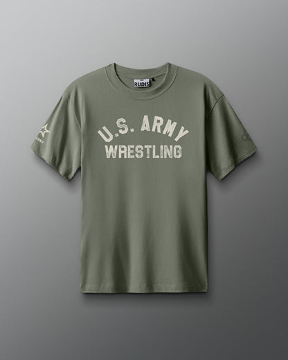 Front view of an olive green RUDIS T-shirt with distressed white text reading ‘U.S. ARMY WRESTLING’ across the chest. A U.S. Army logo appears on the left sleeve, and the RUDIS hexagon logo on the right sleeve.