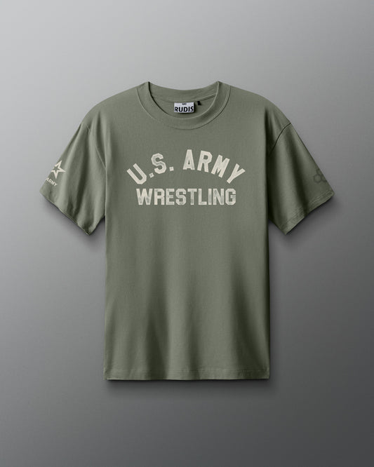 Front view of an olive green RUDIS T-shirt with distressed white text reading ‘U.S. ARMY WRESTLING’ across the chest. A U.S. Army logo appears on the left sleeve, and the RUDIS hexagon logo on the right sleeve.