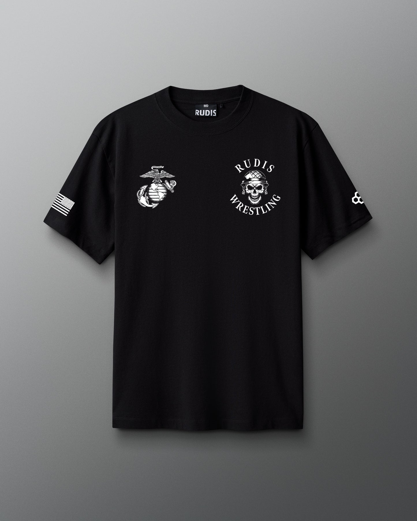 Front view of a black RUDIS T-shirt featuring a white United States Marine Corps emblem on the left chest and a skull in a combat helmet with ‘RUDIS Wrestling’ text on the right chest, along with an American flag on one sleeve and RUDIS hexagon logo on the other.