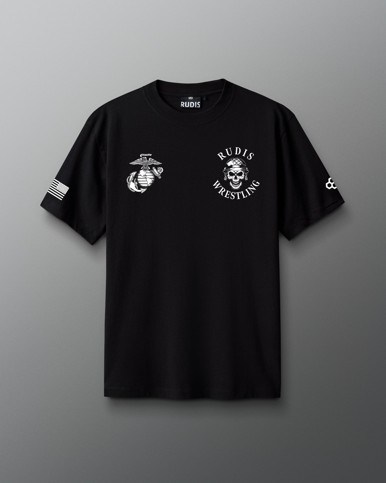 Front view of a black RUDIS T-shirt featuring a white United States Marine Corps emblem on the left chest and a skull in a combat helmet with ‘RUDIS Wrestling’ text on the right chest, along with an American flag on one sleeve and RUDIS hexagon logo on the other.