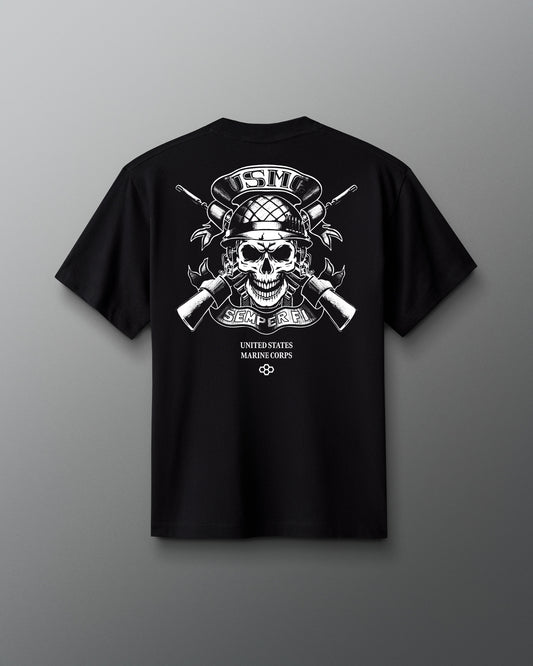 Back view of a black T-shirt featuring a white graphic of a skull wearing a combat helmet, crossed rifles, and the words ‘USMC,’ ‘Semper Fi,’ and ‘United States Marine Corps’ below.