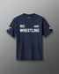 Front view of a navy blue RUDIS T-shirt featuring white text that reads ‘NAVY WRESTLING’ with an American flag graphic, a U.S. Navy insignia on the left sleeve, and a RUDIS hexagon logo on the right sleeve.