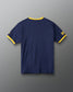 RUDIS U.S. Navy Ringer T-Shirt in Navy/Yellow, back view showing solid navy fabric, contrasting yellow collar and sleeve trim, and military-inspired sleeve graphics.