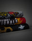 Three folded athletic t-shirts stacked on a dark gray background. The top t-shirt is heather gray with a yellow and red tiger graphic.